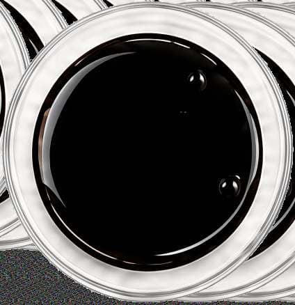 Dark Shilajit extract powder in a round dish